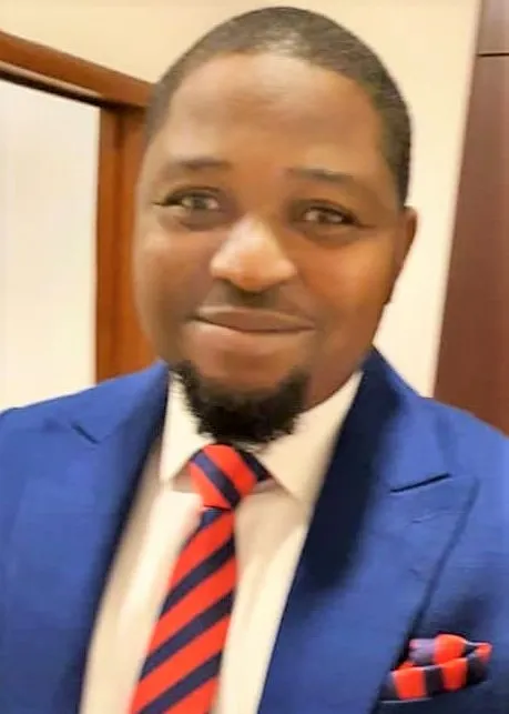 Uloko Fred in conversation with a military officer at a business summit